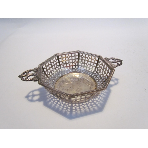 7463 - A Mappin and Webb pierced bowl, Birmingham 1938, an A and J Zimmerman Ltd silver ashtray, Birmingham... 