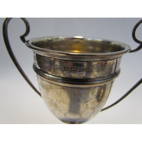 7465 - Five silver sporting awards including trophy with cover 'Worthing Golf Club Juvenile Challenge Cup 1... 