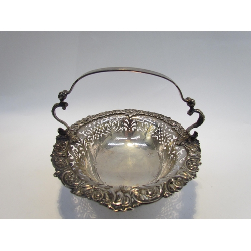 7468 - A CH and Co silver pierced basket with overhead handle, London 1937, 542g