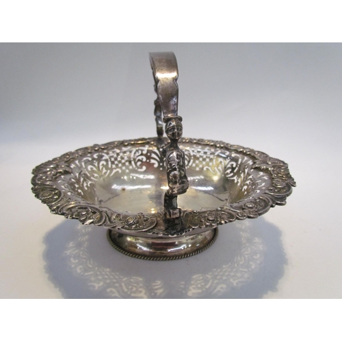 7468 - A CH and Co silver pierced basket with overhead handle, London 1937, 542g