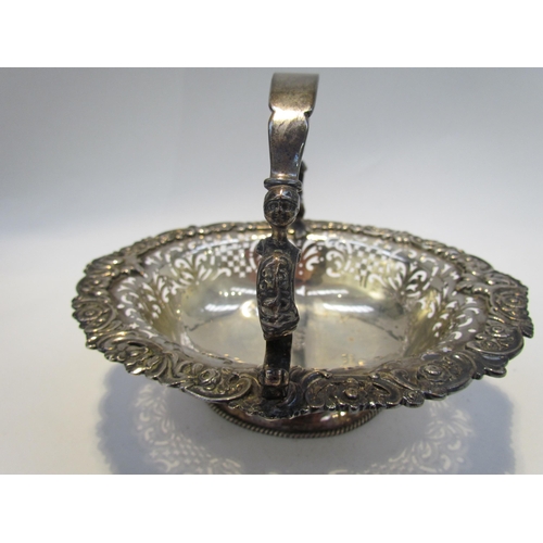 7468 - A CH and Co silver pierced basket with overhead handle, London 1937, 542g