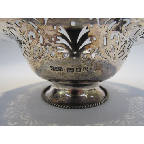 7468 - A CH and Co silver pierced basket with overhead handle, London 1937, 542g