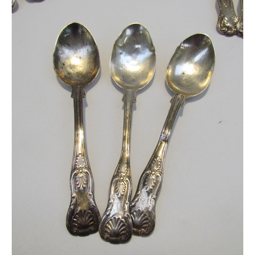 7469 - A quantity of Kings pattern silver flatware comprising of three serving spoons, six small forks, six... 