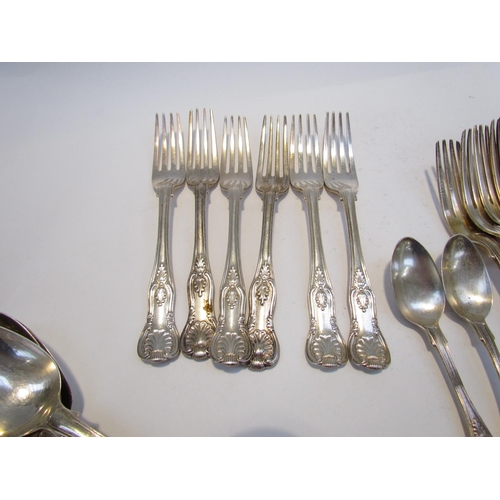 7469 - A quantity of Kings pattern silver flatware comprising of three serving spoons, six small forks, six... 