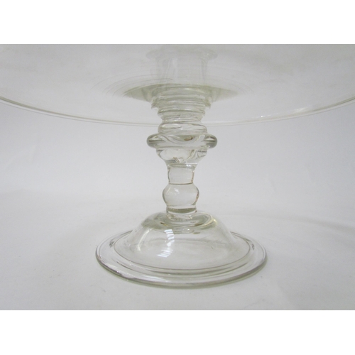 7483 - A Georgian clear glass footed tazza, 21cm diameter