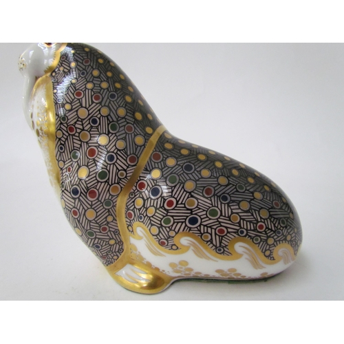 7490 - A Royal Crown Derby paperweight as a Walrus, gold stopper