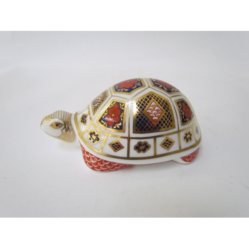 7499 - A pair of Royal Crown Derby paperweights as Tortoises, gold stoppers and a Royal Crown Derby paperwe... 