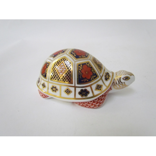 7499 - A pair of Royal Crown Derby paperweights as Tortoises, gold stoppers and a Royal Crown Derby paperwe... 