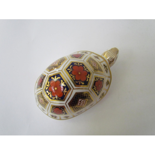 7499 - A pair of Royal Crown Derby paperweights as Tortoises, gold stoppers and a Royal Crown Derby paperwe... 