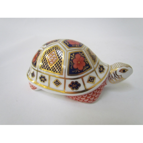 7499 - A pair of Royal Crown Derby paperweights as Tortoises, gold stoppers and a Royal Crown Derby paperwe... 