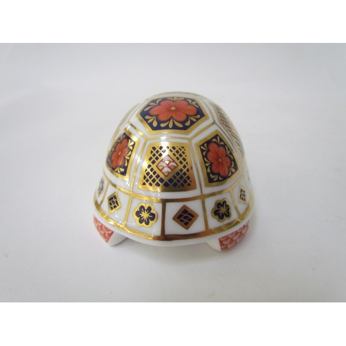 7499 - A pair of Royal Crown Derby paperweights as Tortoises, gold stoppers and a Royal Crown Derby paperwe... 