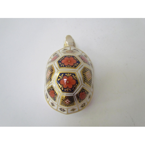 7499 - A pair of Royal Crown Derby paperweights as Tortoises, gold stoppers and a Royal Crown Derby paperwe... 