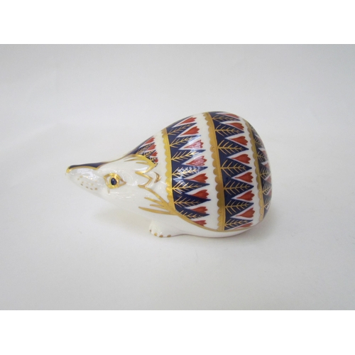 7500 - A Royal Crown Derby badger paperweight, gold stopper and a Royal Crown Derby paperweight as a Hedgeh... 