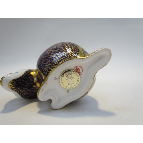 7500 - A Royal Crown Derby badger paperweight, gold stopper and a Royal Crown Derby paperweight as a Hedgeh... 