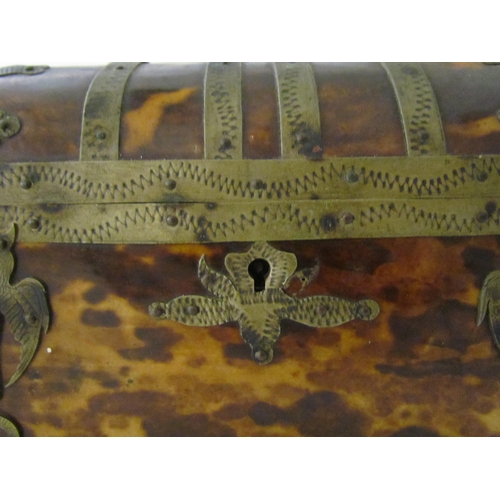 7514 - A 19th Century tortoiseshell dome top metal bound casket, 14cm x 12cm x 8cm, one foot missing