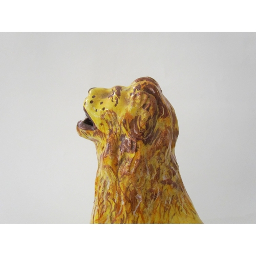 7518 - A 19th Century Italian faience figure of a lion with heraldic crest, 23cm high