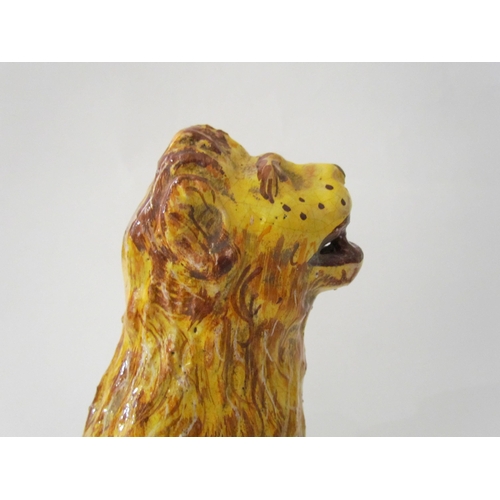 7518 - A 19th Century Italian faience figure of a lion with heraldic crest, 23cm high