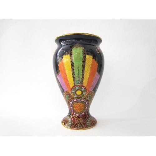 7519 - A Carlton Ware lustre vase with Art Deco styling, blue ground with multicoloured patterns, enriched ... 