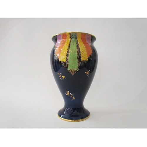 7519 - A Carlton Ware lustre vase with Art Deco styling, blue ground with multicoloured patterns, enriched ... 