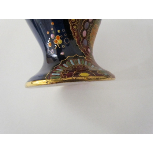 7519 - A Carlton Ware lustre vase with Art Deco styling, blue ground with multicoloured patterns, enriched ... 