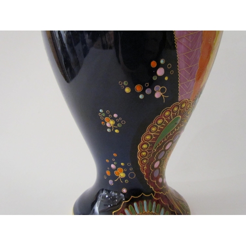 7519 - A Carlton Ware lustre vase with Art Deco styling, blue ground with multicoloured patterns, enriched ... 