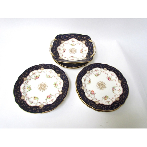 7528 - A late 19th / early 20th Century Coalport dessert set consisting of six plates and twin handle servi... 