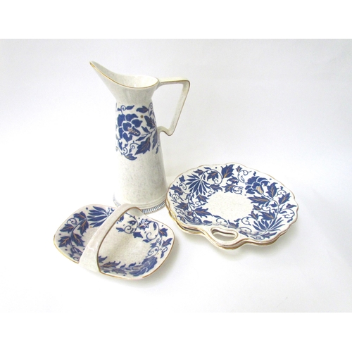 7531 - A Charlotte Rhead jug, two leaf form plates and basket dish pattern.  TL40 (4)  (E)  £30-40