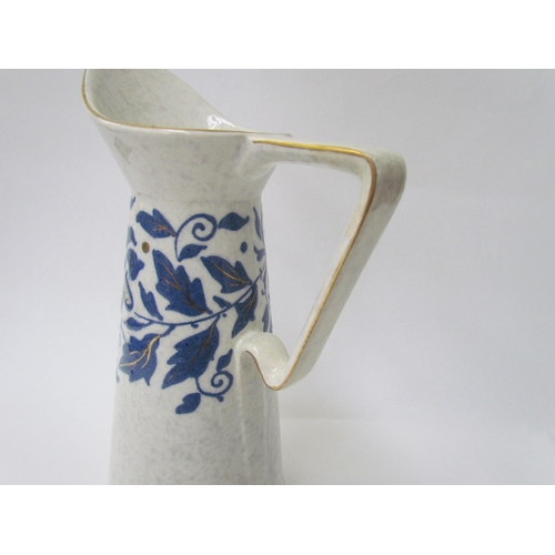 7531 - A Charlotte Rhead jug, two leaf form plates and basket dish pattern.  TL40 (4)  (E)  £30-40