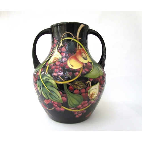 7536 - A Moorcroft Queen's Choice pattern large twin handled vase, by Emma Bossons. Second, 34cm tall  (R) ... 