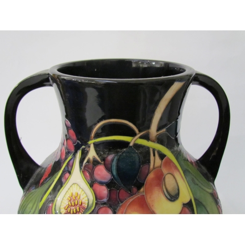 7536 - A Moorcroft Queen's Choice pattern large twin handled vase, by Emma Bossons. Second, 34cm tall  (R) ... 