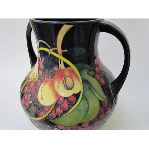 7536 - A Moorcroft Queen's Choice pattern large twin handled vase, by Emma Bossons. Second, 34cm tall  (R) ... 