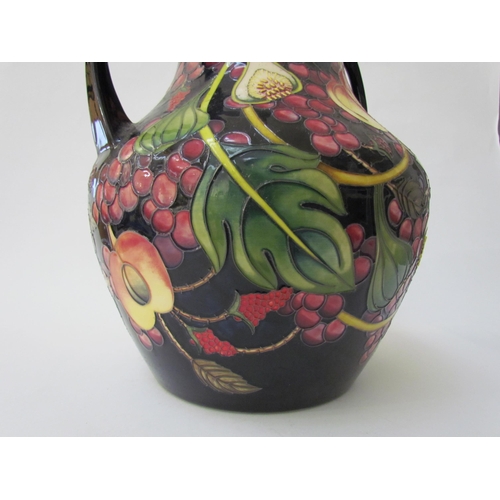 7536 - A Moorcroft Queen's Choice pattern large twin handled vase, by Emma Bossons. Second, 34cm tall  (R) ... 