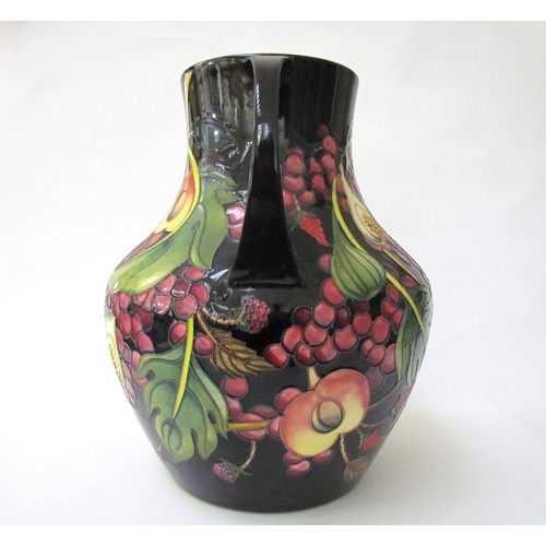 7536 - A Moorcroft Queen's Choice pattern large twin handled vase, by Emma Bossons. Second, 34cm tall  (R) ... 