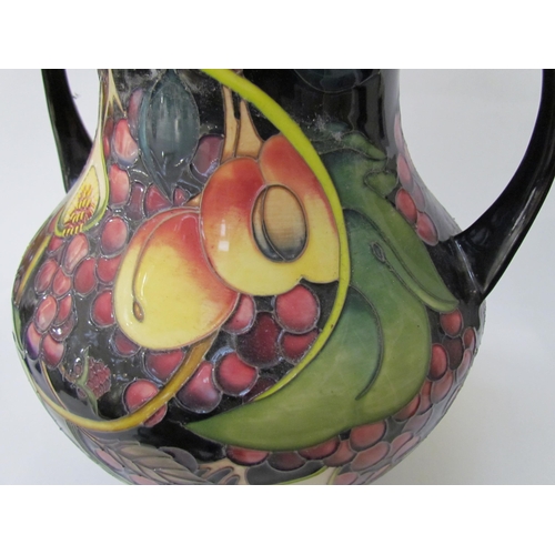 7536 - A Moorcroft Queen's Choice pattern large twin handled vase, by Emma Bossons. Second, 34cm tall  (R) ... 