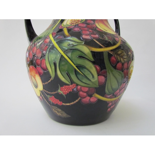 7536 - A Moorcroft Queen's Choice pattern large twin handled vase, by Emma Bossons. Second, 34cm tall  (R) ... 