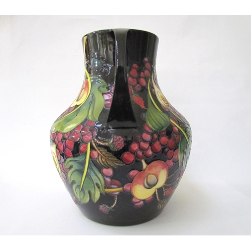 7536 - A Moorcroft Queen's Choice pattern large twin handled vase, by Emma Bossons. Second, 34cm tall  (R) ... 