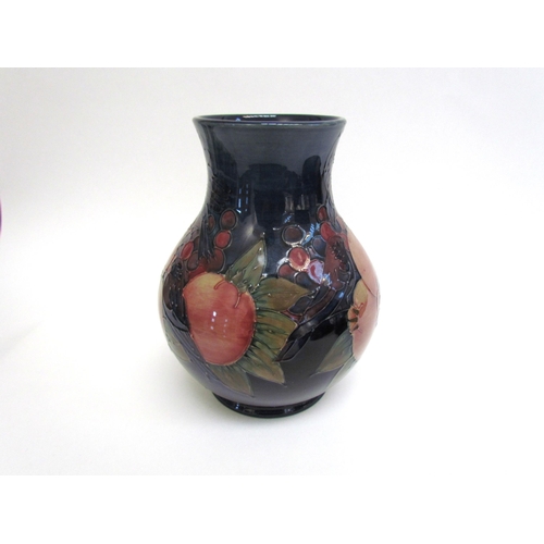 7542 - A Moorcroft Finches and Berries on blue pattern vase, 24cm tall  (R)  £120  NEXT SPECIAL