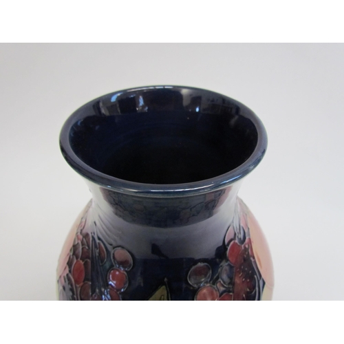 7542 - A Moorcroft Finches and Berries on blue pattern vase, 24cm tall  (R)  £120  NEXT SPECIAL