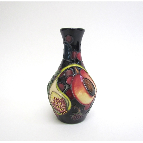 7551 - A Moorcroft Queen's Choice pattern vase, 14cm tall