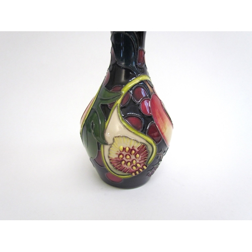 7551 - A Moorcroft Queen's Choice pattern vase, 14cm tall