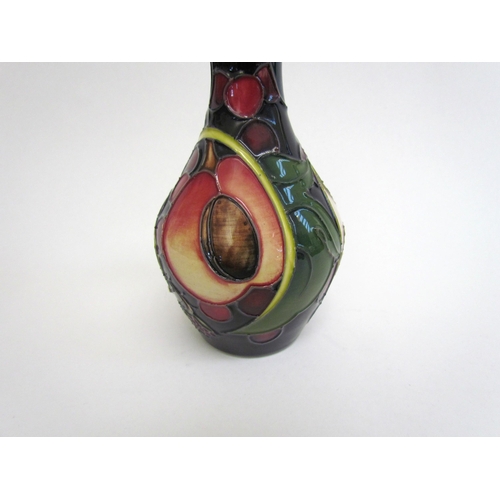 7551 - A Moorcroft Queen's Choice pattern vase, 14cm tall