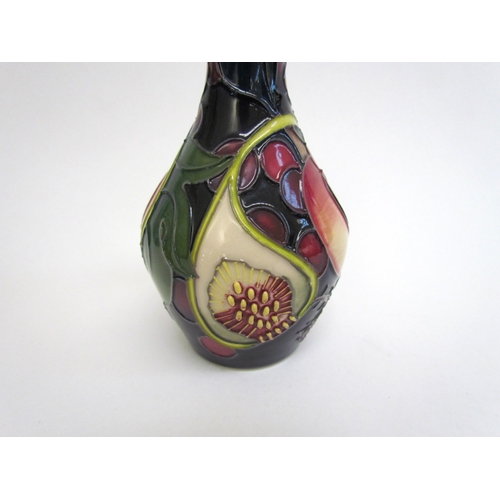 7551 - A Moorcroft Queen's Choice pattern vase, 14cm tall