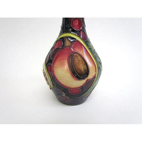 7551 - A Moorcroft Queen's Choice pattern vase, 14cm tall