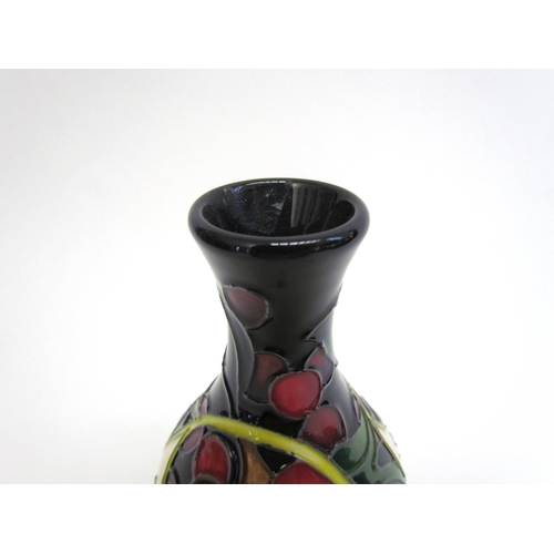 7551 - A Moorcroft Queen's Choice pattern vase, 14cm tall