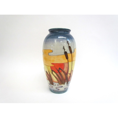 7552 - A Moorcroft Reeds at Sunset pattern vase, 25.5cm tall