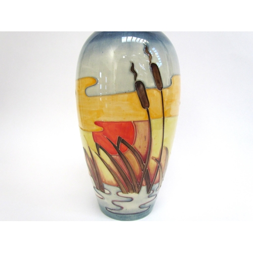 7552 - A Moorcroft Reeds at Sunset pattern vase, 25.5cm tall