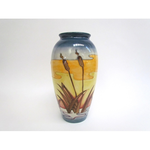 7552 - A Moorcroft Reeds at Sunset pattern vase, 25.5cm tall