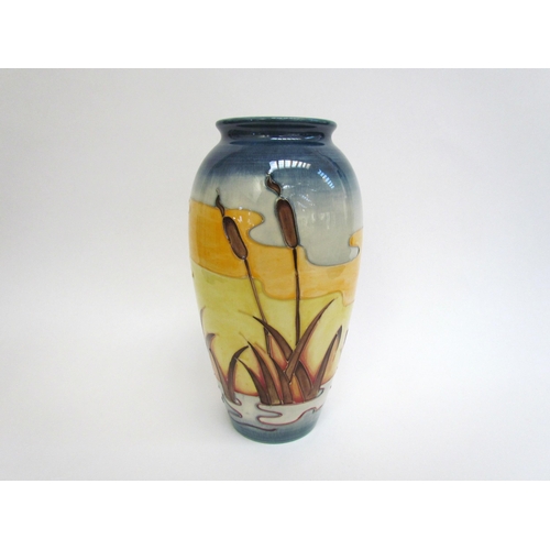 7552 - A Moorcroft Reeds at Sunset pattern vase, 25.5cm tall