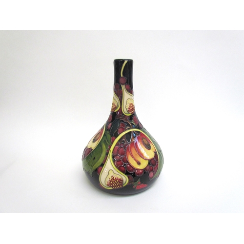 7554 - A Moorcroft Queen's Choice pattern vase with slender neck by Emma Bossons. Second, 28cm tall