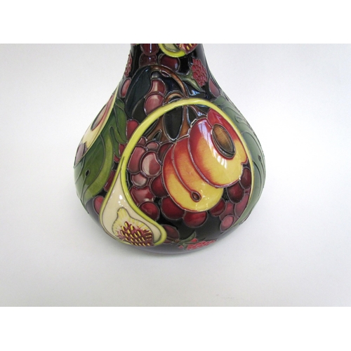 7554 - A Moorcroft Queen's Choice pattern vase with slender neck by Emma Bossons. Second, 28cm tall